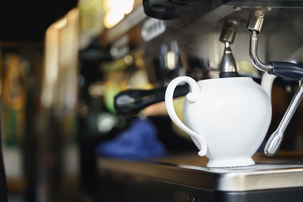 Photo pouring hot water from coffee blending machine