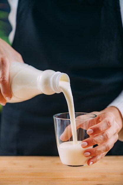 Pouring kefir into glass a healthy fermented dairy superfood drink