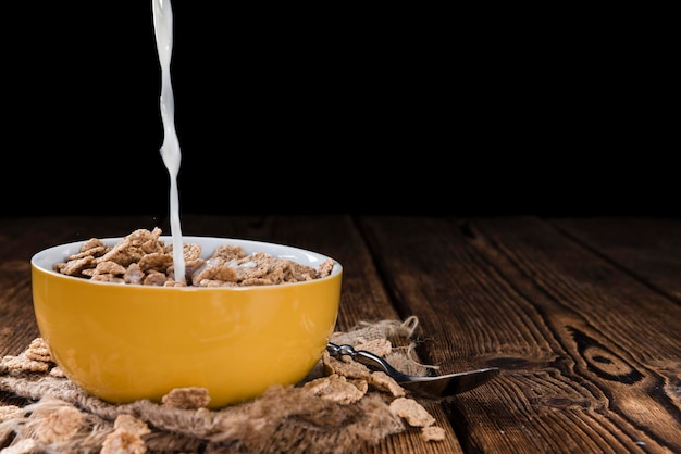 Pouring Milk in a bowl with Cornflakes