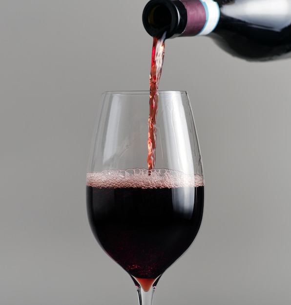 Pouring red wine