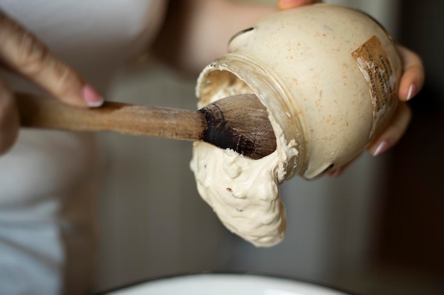 Pouring sourdough from jar