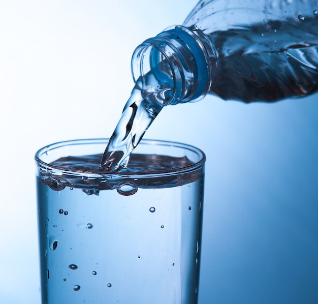 pouring water in glass