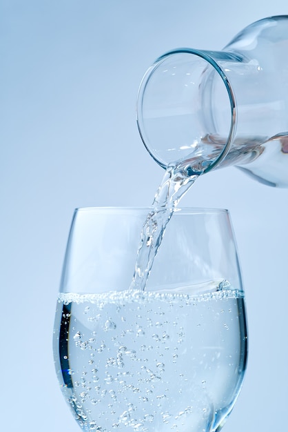 Pouring water. pouring drinking water from a glass decanter to
glass.