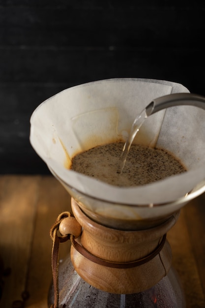 Pouring water to prepare a cup of coffee