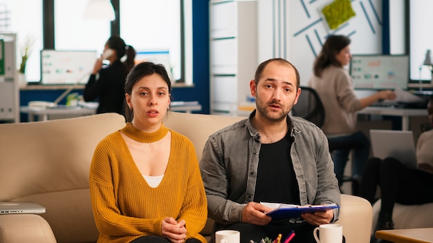 Pov of colleagues talking with partners using webcam during
video conference explaining financial annual reports, planning a
new business in start up office. diverse team planning strategy
with partne