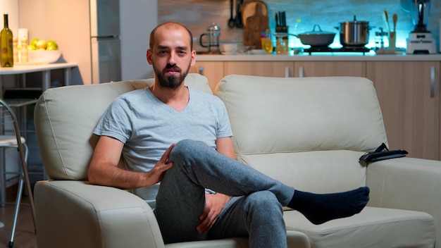 Pov of freelancer man sitting on couch recording business interview