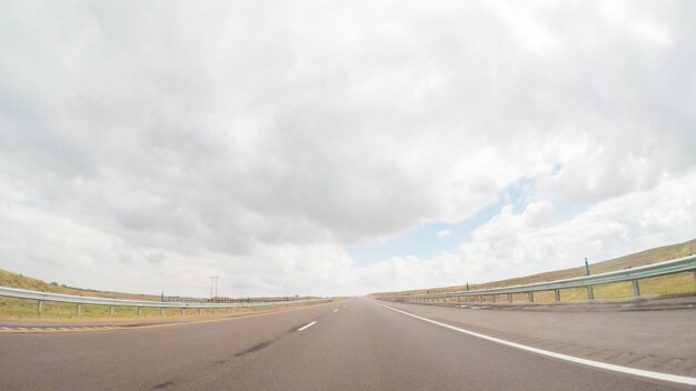 Pov point of view -driving east on interstate highway 76 in the\
spring.