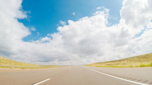 Pov point of view -driving east on interstate highway 76 in the\
spring.