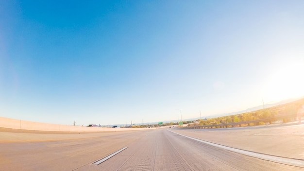 POV point of view -Driving South in Interstate highway I25 at sunset.