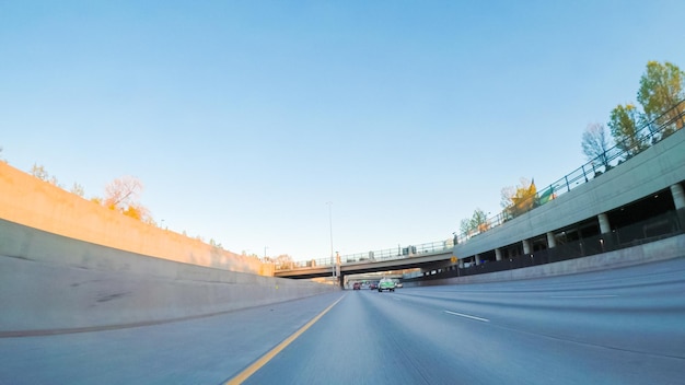 Pov point of view -driving south in interstate highway i25 at sunset