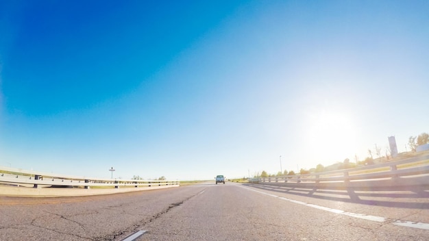 POV point of view -Driving West on Interstate highway I76 at sunset.