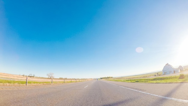 Pov point of view -driving west on interstate highway i76 at sunset