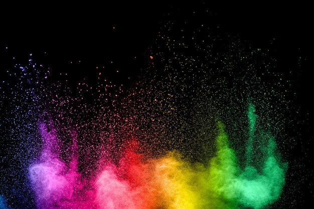 Photo powder paint exploding over black background