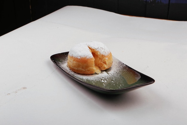 Powder sugar fall over donuts Berliner