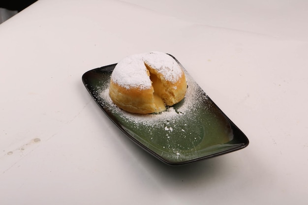 Powder sugar fall over donuts, Berliner