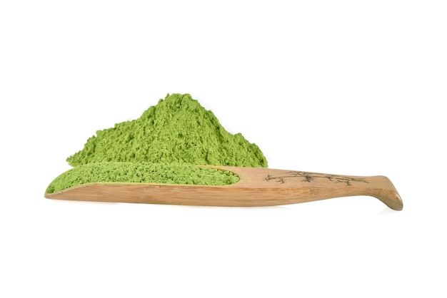 Powdered green tea with bamboo spoon , isolated on white