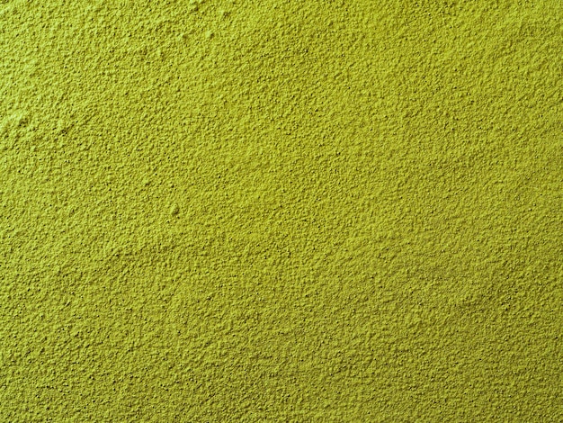 Powdered matcha green tea background closeup