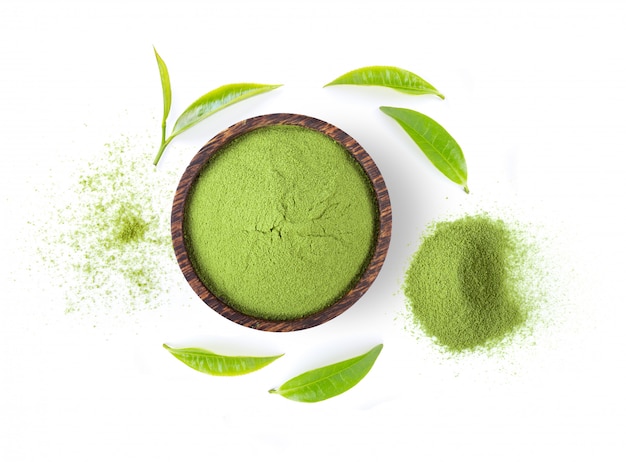 Powdered matcha green tea in bowl isolated