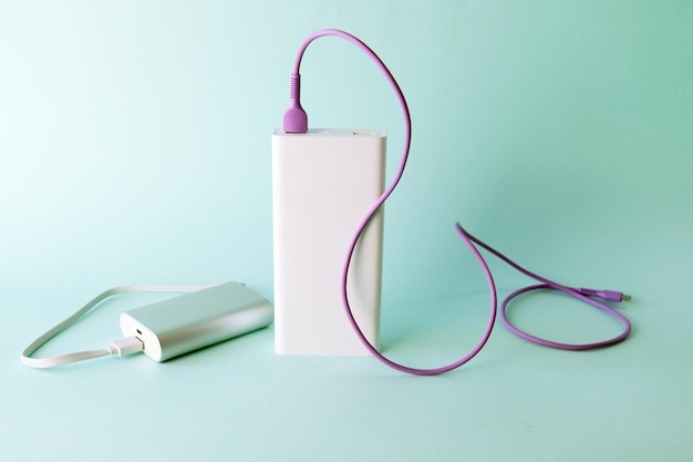 Power bank, external battery and usb wire on the table