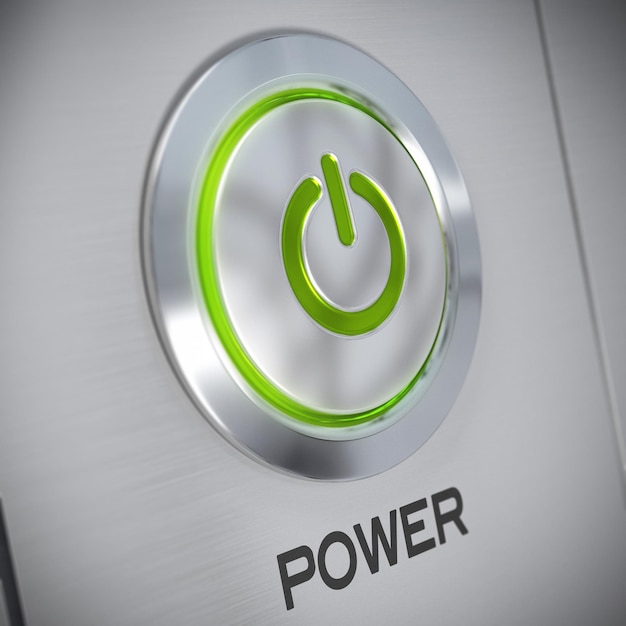 Photo power button on a brushed aluminum panel with a green light and the symbol of energy start, blur effect