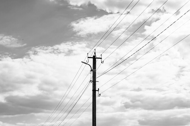 Power electric pole with line wire on dark background close up