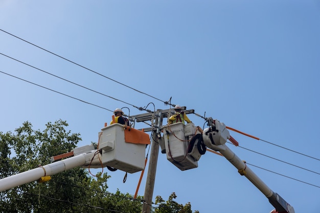 Power electrical lines support service men working handling damage after hurricane