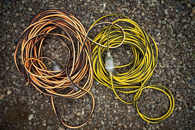 Photo power lead on a building site electrician with a power cable