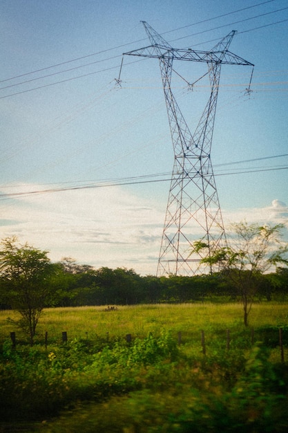 A power line tower in a field