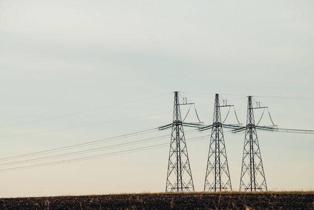 Power lines on background of blue sky close-up. 