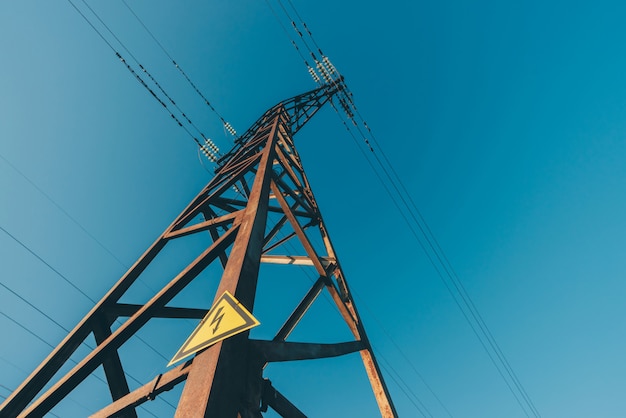 Power lines on background of blue sky close-up.