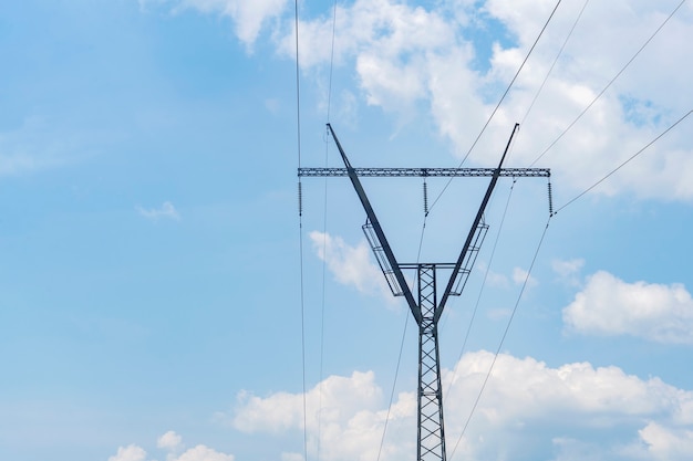 Power lines on the background of the blue sky.