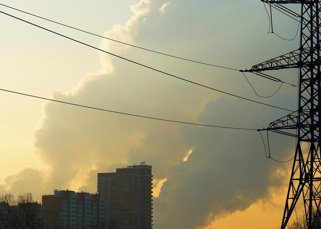 Power lines above city buildings background