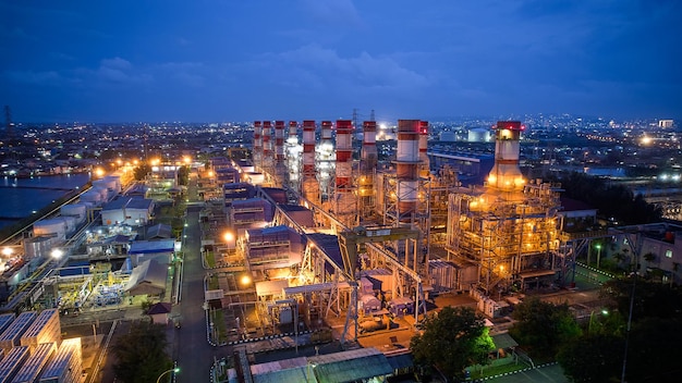 A power plant at night with the lights on