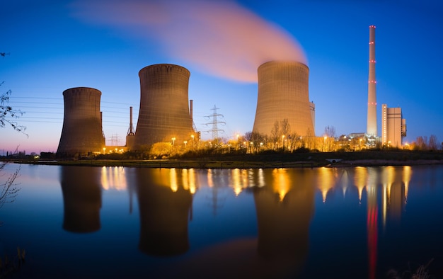 Photo power plant at river panorama at night