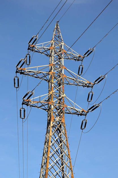 A power pole with a blue sky in the background