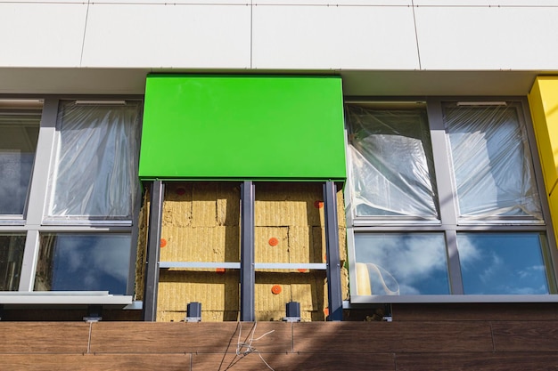 Power saving technology: plates of mineral wool on the side wall, between the metal profiles for attaching the ventilated facade.