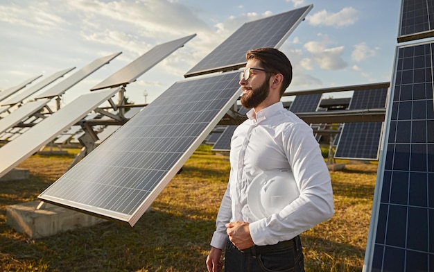 Power station owner near photovoltaic panels