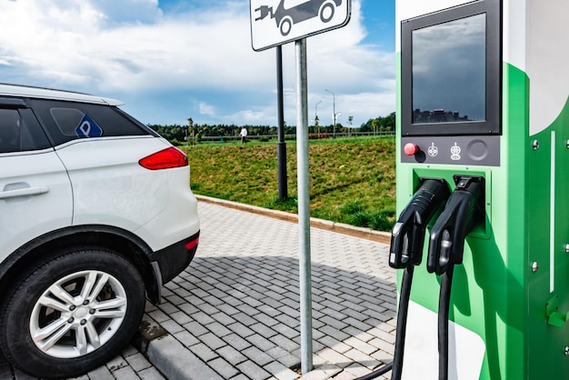 Power supply for charging of electric car on parking lot. Electric car charching station.