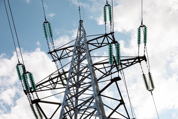 Power tower against blue sky