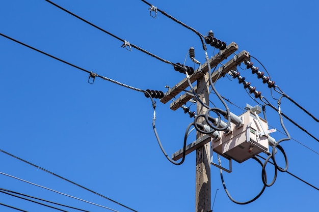 Power utility pole with transformers