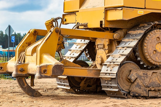 Powerful crawler bulldozer closeup at the construction site\
construction equipment for moving large volumes of soil modern\
construction machine road building machine