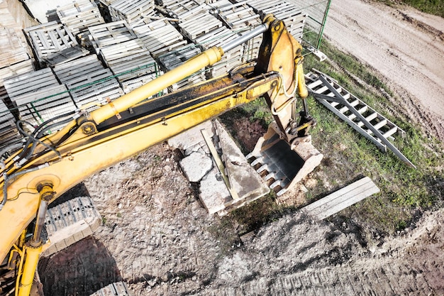 A powerful crawler excavator is working on a construction site Closeup