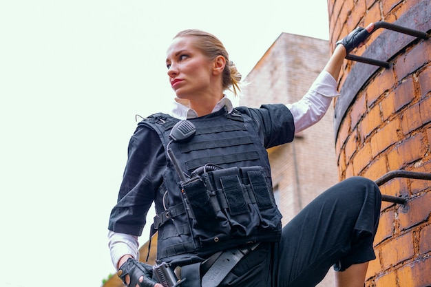 Powerful Woman Holding Gun. War Action Movie Style