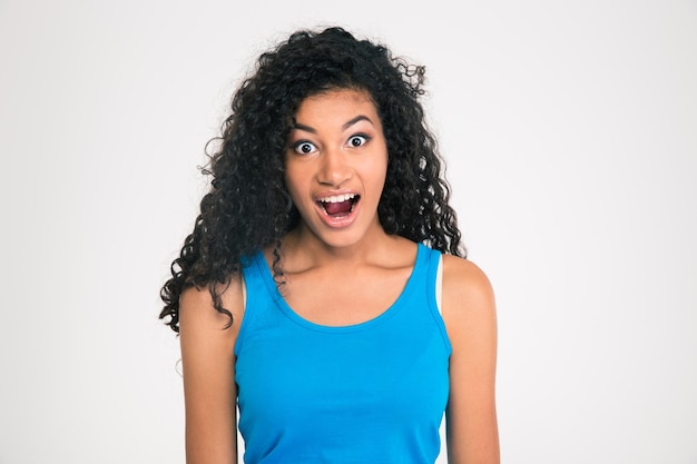 Pportrait of a shocked afro american woman looking at camera isolated