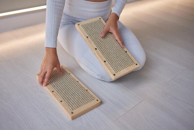 Practice of standing on nails Woman meditation before stand on sadhu board