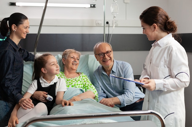 Practitioner doctor explaining disease diagnosis to elderly woman