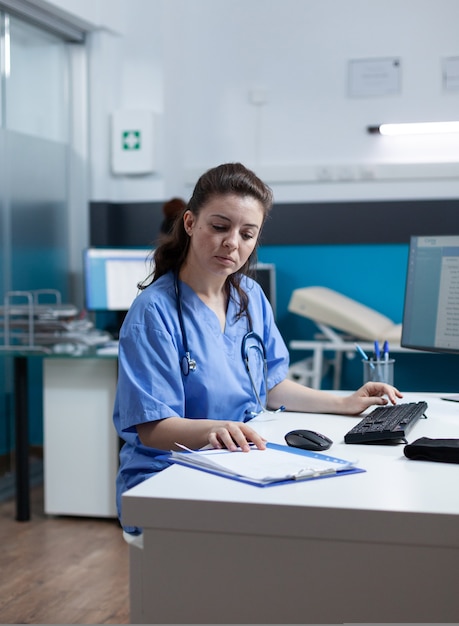 Practitioner nurse with stethoscope analyzing healthcare treatment