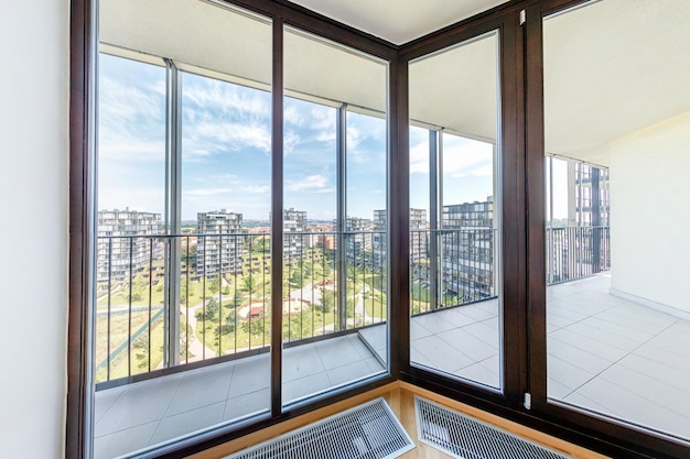 PRAHA Czech Republic JULY 21 2014 Modern white empty loft apartment interior living room hall ace panorama Overlooking with window on the metropolis city