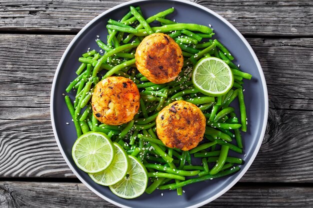 Prawn and Crab Cakes on a plate with green beans