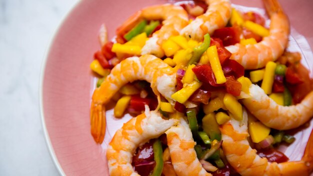 Prawn salad with mango, tomato and pepper.